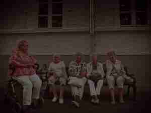 Elderly ladies sitting down talking