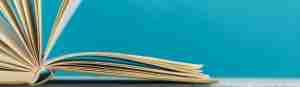 open hardback book on blue background