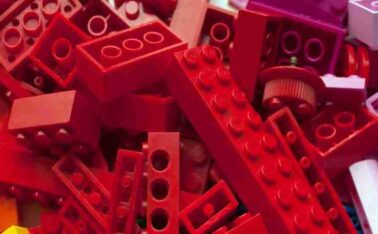 pile of yellow, orange, red and purple lego to represent outcome driven innovation