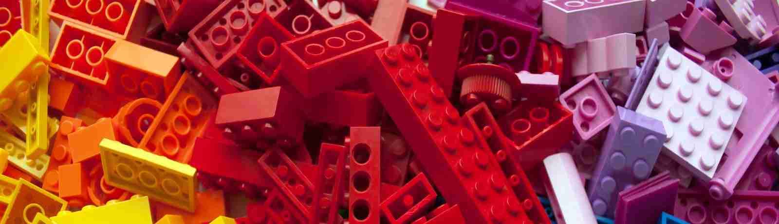 pile of yellow, orange, red and purple lego to represent outcome driven innovation