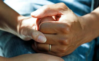 person in aged care wearing gold wedding band