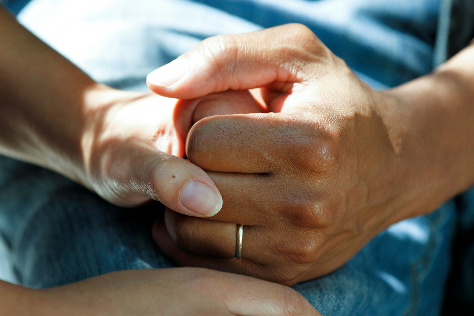 person in aged care wearing gold wedding band