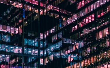 architectural photography of building with people in it during nighttime